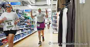 People in fancy dress run through supermarket aisles in marathon in a Tesco