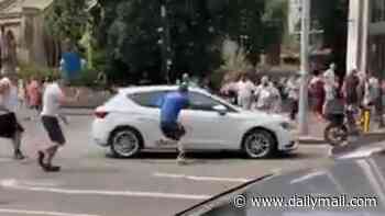 Somalia-born man, 34, is charged with attempted murder after five people were struck by a car in London