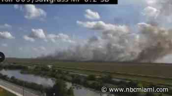 Brush fire seen burning in West Broward