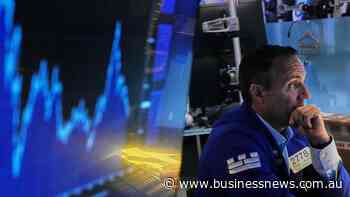 Wall Street ends lower as shares of chip firms tumble