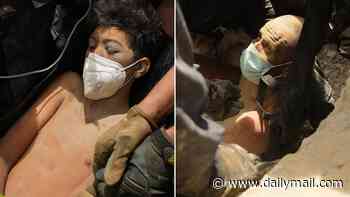 Extraordinary moment dad and young son are pulled alive from rubble four days after Venezuela earthquakes as rescuers hail 'miracle' survival