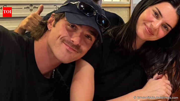 Kendall and Jacob walk hand-in-hand at Brisbane airport - PICS