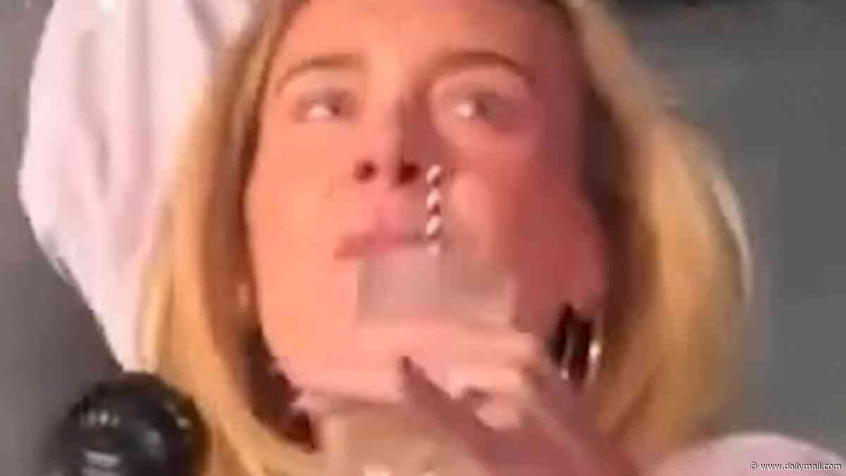 Margot Robbie blends in with concertgoers as she wears a baseball T-shirt and tiny shorts while partying at the Bad Bunny concert in London