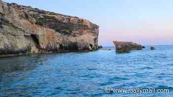 Tourist is crushed to death when Malta's famous 'Kissing Elephants' archway collapses on to his jet ski 'after US holidaymaker jumps off the rock formation into the sea'