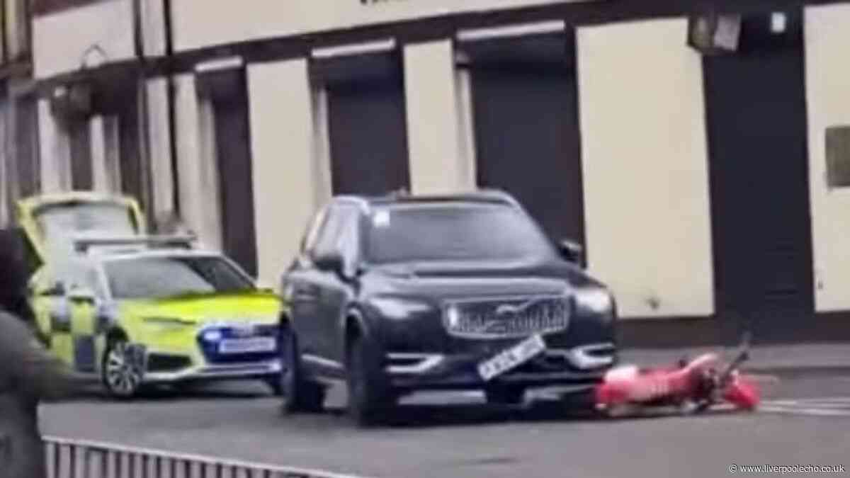 Man injured in police crash as Liverpool road cordoned off
