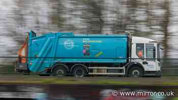 Man inside bin is tipped into Bristol rubbish lorry with its machinery running