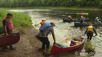 Over 100 people paddle to protest Sisson Mine