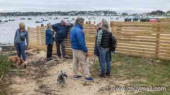 Sandbanks residents claim victory in battle over 'private beach': Lawyers argue public should have access after land was fenced off by mansion owner