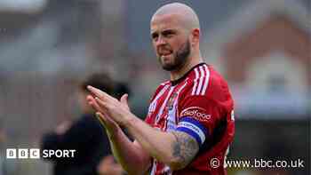 Cheltenham Town sign defenders Sweeney and Tomlinson