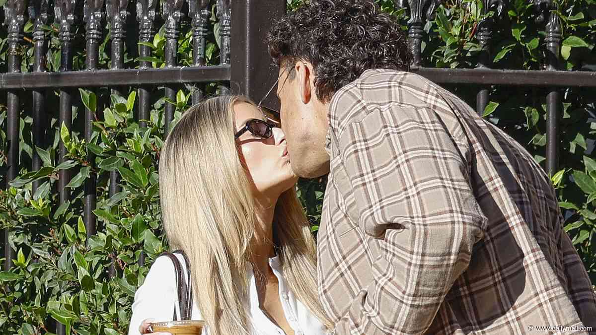 Australia's hottest WAG Chelsea Becirevic and former AFL player Ivan Soldo share a kiss as they step out for coffee in Melbourne - after cryptic posts spark split speculation