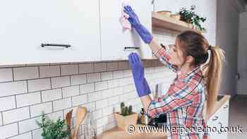Clean grimy kitchen cabinets with 'powerful' 2-ingredient solution — no scrubbing needed