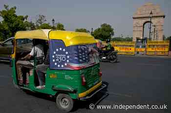 Why Trump’s face can be seen zooming in and out of India’s rush-hour traffic