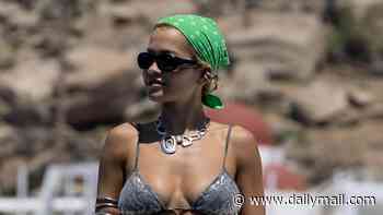 Rita Ora sizzles in a metallic snakeskin bikini as she soaks up the sun on a luxury yacht with pals in Mykonos