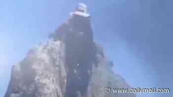 Hiker falls to his death in front of tour group after posing for a photograph at the top of Brazilian cliff