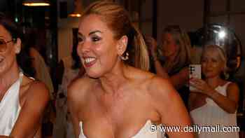 Claire Sweeney turns heads in a low-cut white dress as she dances the night away while pal DJ Fat Tony hits the decks at The Lady Wimbledon's Tennis Party