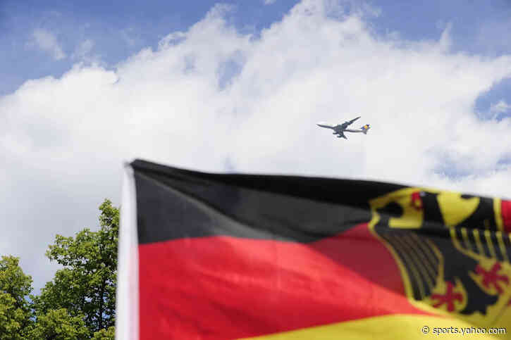 Can the pilot turn back? Germany fan learns of exit on flight to last 16