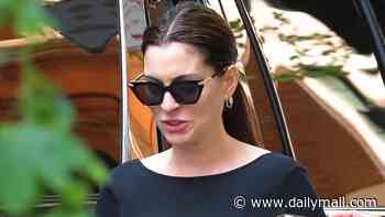 Anne Hathaway, 43, affectionately cradles her baby bump in NYC after unveiling surprise third pregnancy
