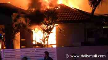 Man dies and two are left fighting for life after a suspected arson attack destroys Gold Coast home