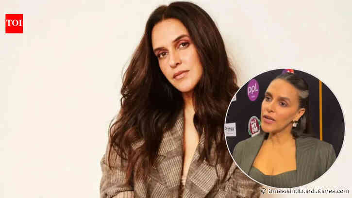 Neha Dhupia loses cool at photographers over 'back shots'