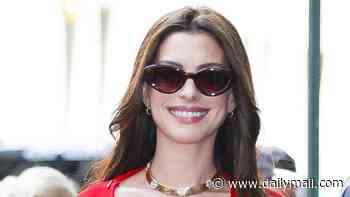 Pregnant Anne Hathaway shows off her bump in a bold red dress after confirming she is expecting a surprise third baby aged 43
