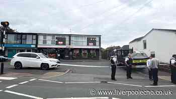 Melling police incident live after man 'shot in the neck'