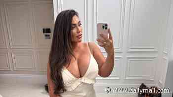 Lauren Goodger shows off her curves as she poses in a skimpy white minidress ahead of filming TOWIE scenes