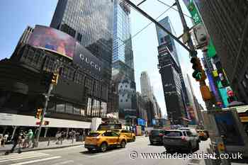 Iconic Times Square billboards are dimmed as heat wave threatens to overwhelm power grids