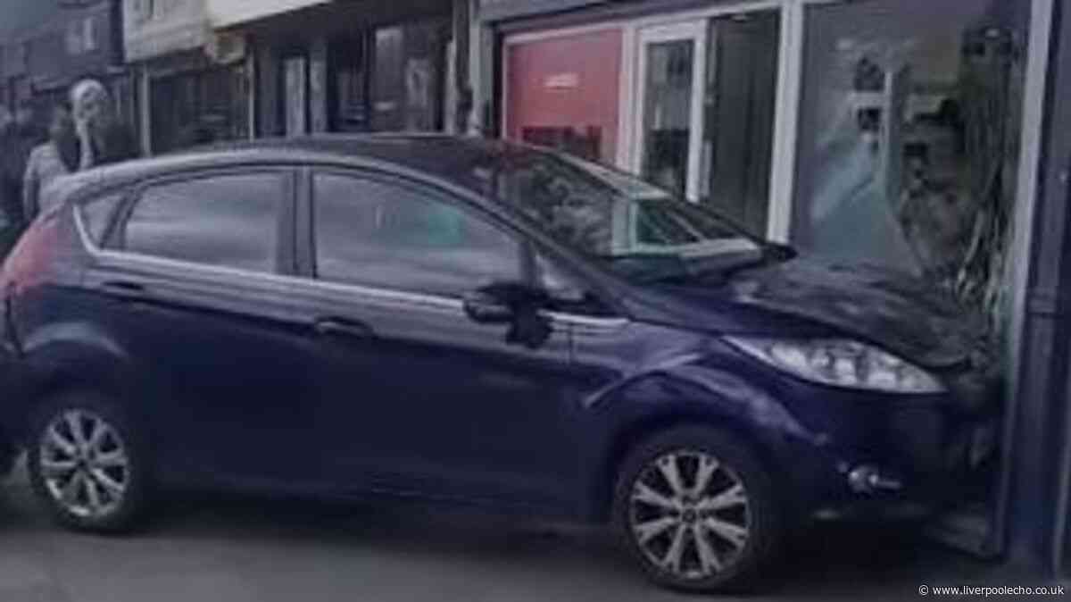 Ford Fiesta smashes into Bootle opticians