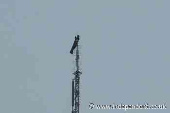 High-risk climbers scale Empire State Building and unfurl banner 1,450 feet in the air