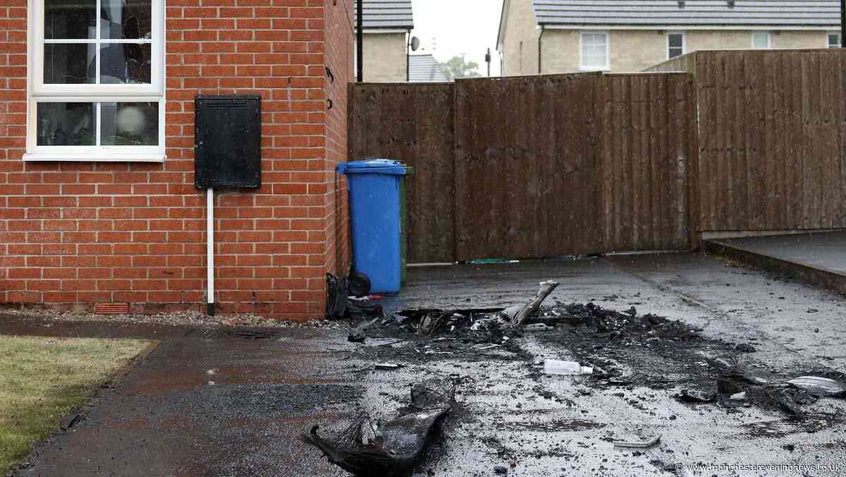 Window smashed and driveway left burnt after car set alight in 'targeted attack'