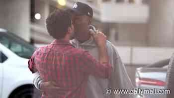 Queer Eye star Karamo Brown passionately kisses Jussie Smollett as shock new couple goes public