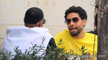 Hate crime hoaxer Jussie Smollett refuses to confirm he's official with Karamo Brown… after passionately smooching Queer Eye star at airport