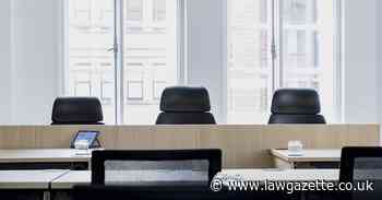 Solicitor suspended for touching junior colleagues and racist remarks
