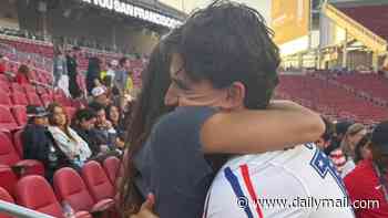 Sealed with a kiss! USA's World Cup heroes celebrate huge win with glamorous WAGs and kids in stands