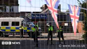 Masked protester grappled police at asylum site