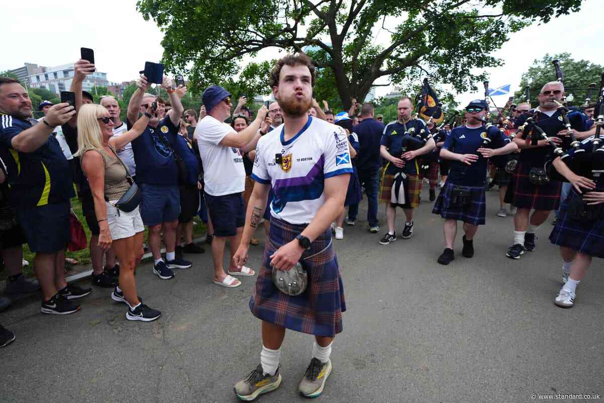 Tartan Army fan who raised £1m for charity in 3,000-mile US walk returns home