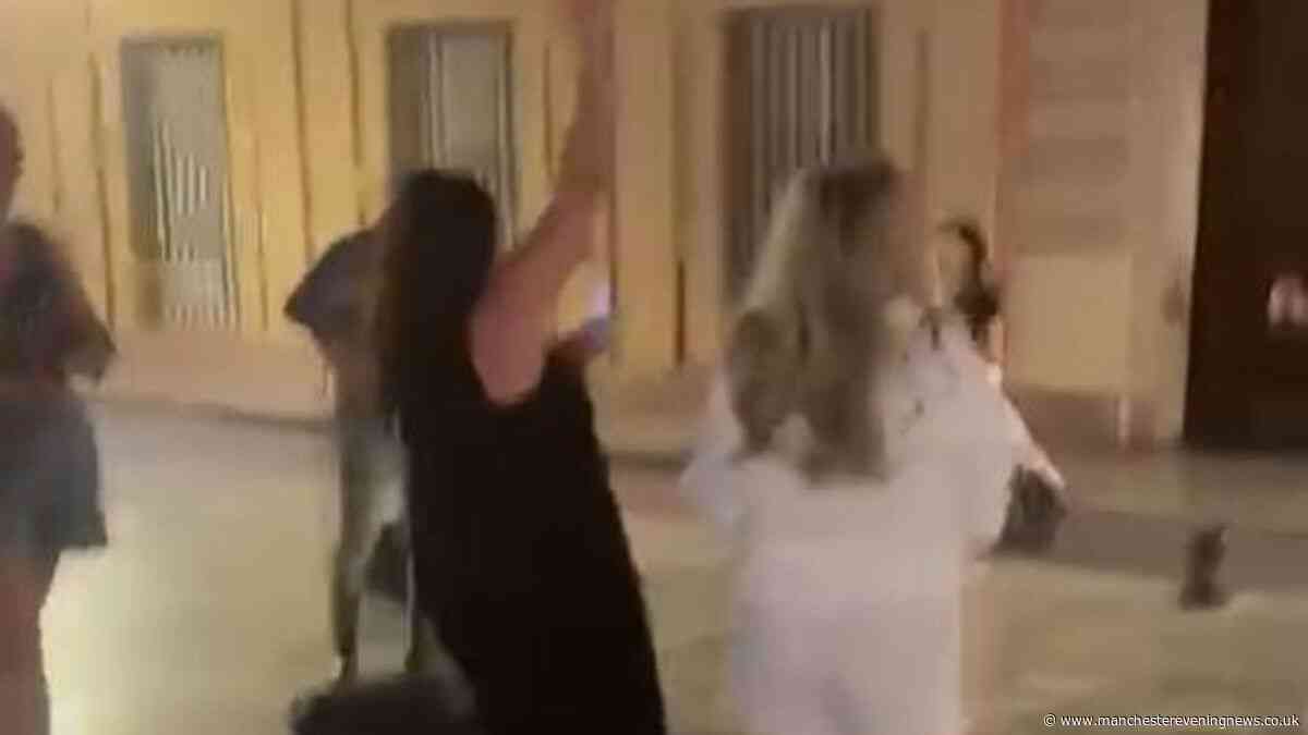 Huge music star starts busking in street in Seville - then tourists realise who it is