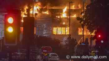 Dozens of firefighters are battling a massive blaze at a Jaguar and Land Rover service centre in London