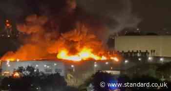 Tottenham fire: Huge blaze rages at Jaguar Land Rover service centre as 100 firefighters battle flames