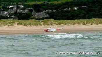 Person clings to cool box for hours after boat capsizes
