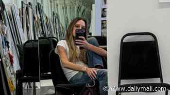 Victoria Beckham looks unbothered as she snaps a selfie in her studio after Katie Price reignited their feud