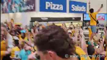 Socceroos fans go WILD ahead of tie with Egypt as they do shoey with Aussie music star and party in supermarket