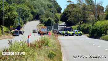 Police close major road after crash involving bus