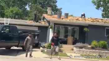 Video captures moment men fall off roof during fight then continue brawl before surprising ending