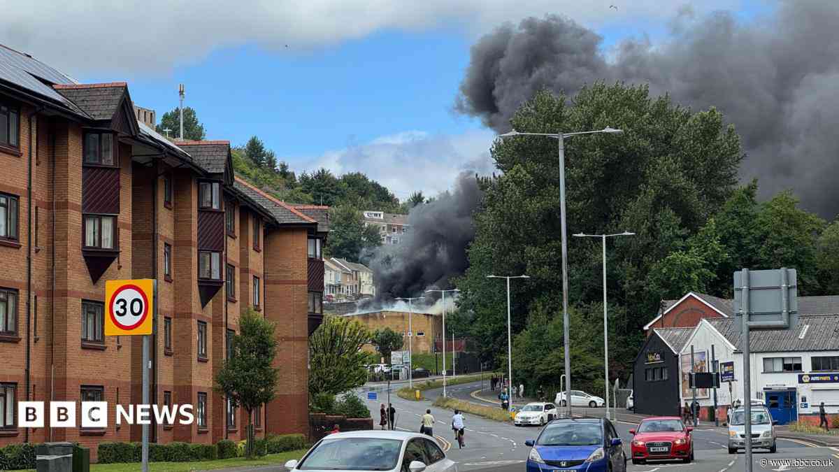 City road shut as fire causes large clouds of black smoke