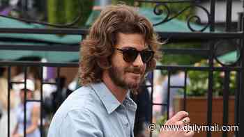 Andrew Garfield sports shaggy locks and a bushy beard as he packs on the PDA with girlfriend Monica Barbaro at Wimbledon a year after sparking hair transplant rumours