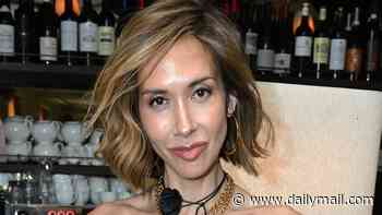 Myleene Klass catches the eye in a sheer black corset as she attends London Pride lunch