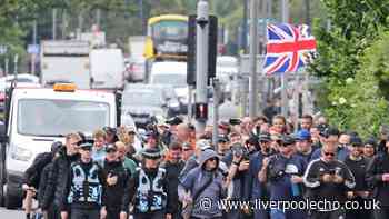 Protestors march on County Road - but many ignore them