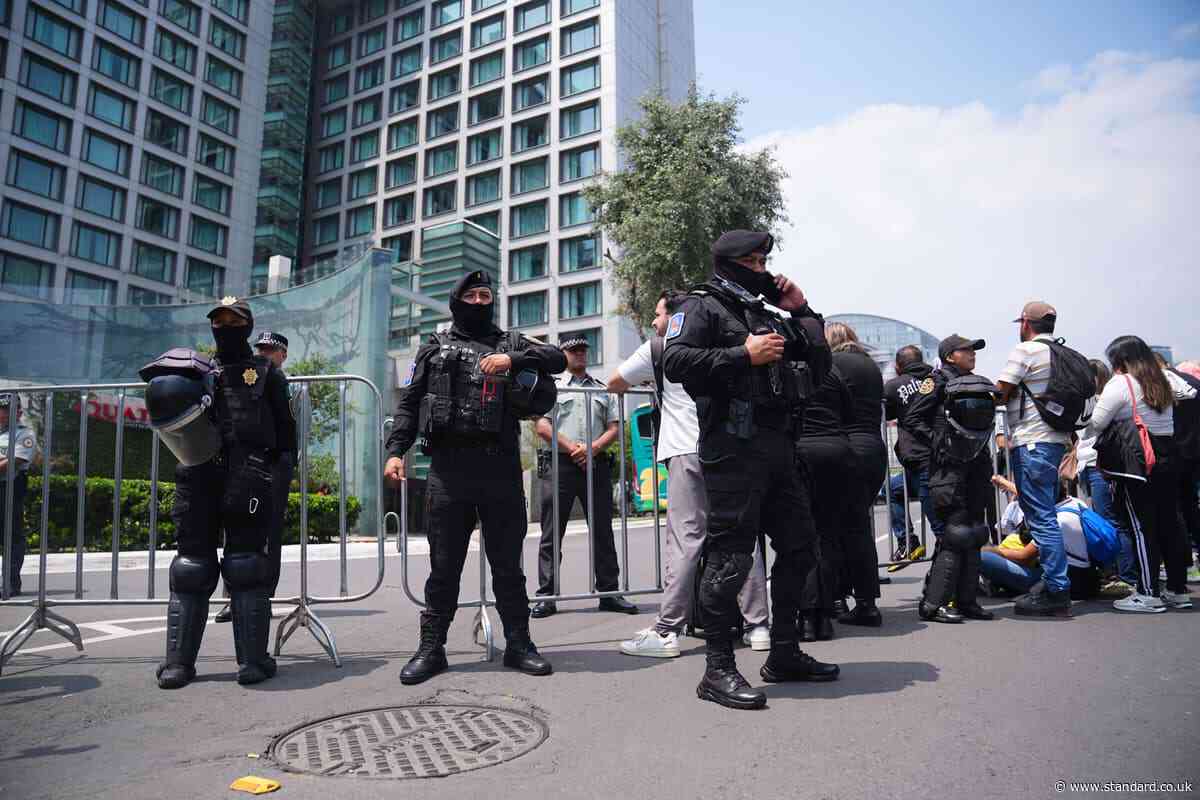 100 riot police guard England hotel as team receive hostile reception in Mexico