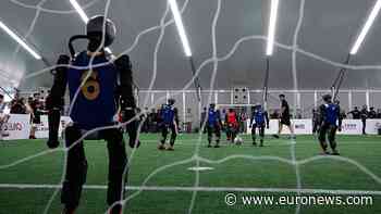 Humanoid robots showcase football skills